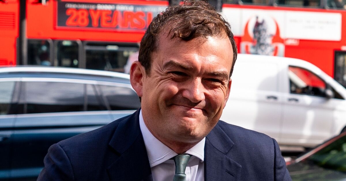 Tory MP Patrick Spencer grins outside court as he faces Groucho Club sex assault charges