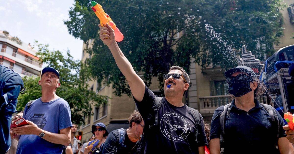 Tourists get last laugh as angry Spanish locals fire water pistols at them