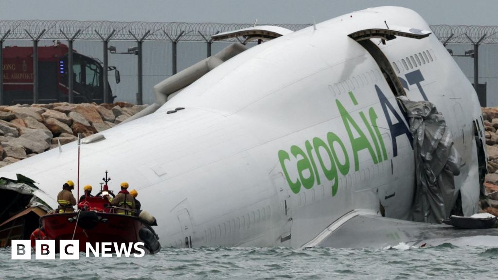 Two dead after cargo plane skids off Hong Kong runway into sea