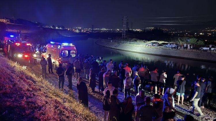 Father and son killed in car that overturned into irrigation canal, many injured