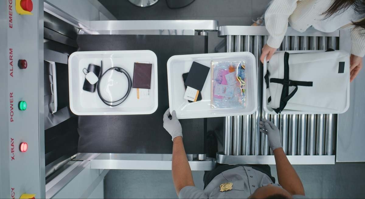 Confirmed: Carrying your phone on at airport security can put you in danger without you even knowing it.