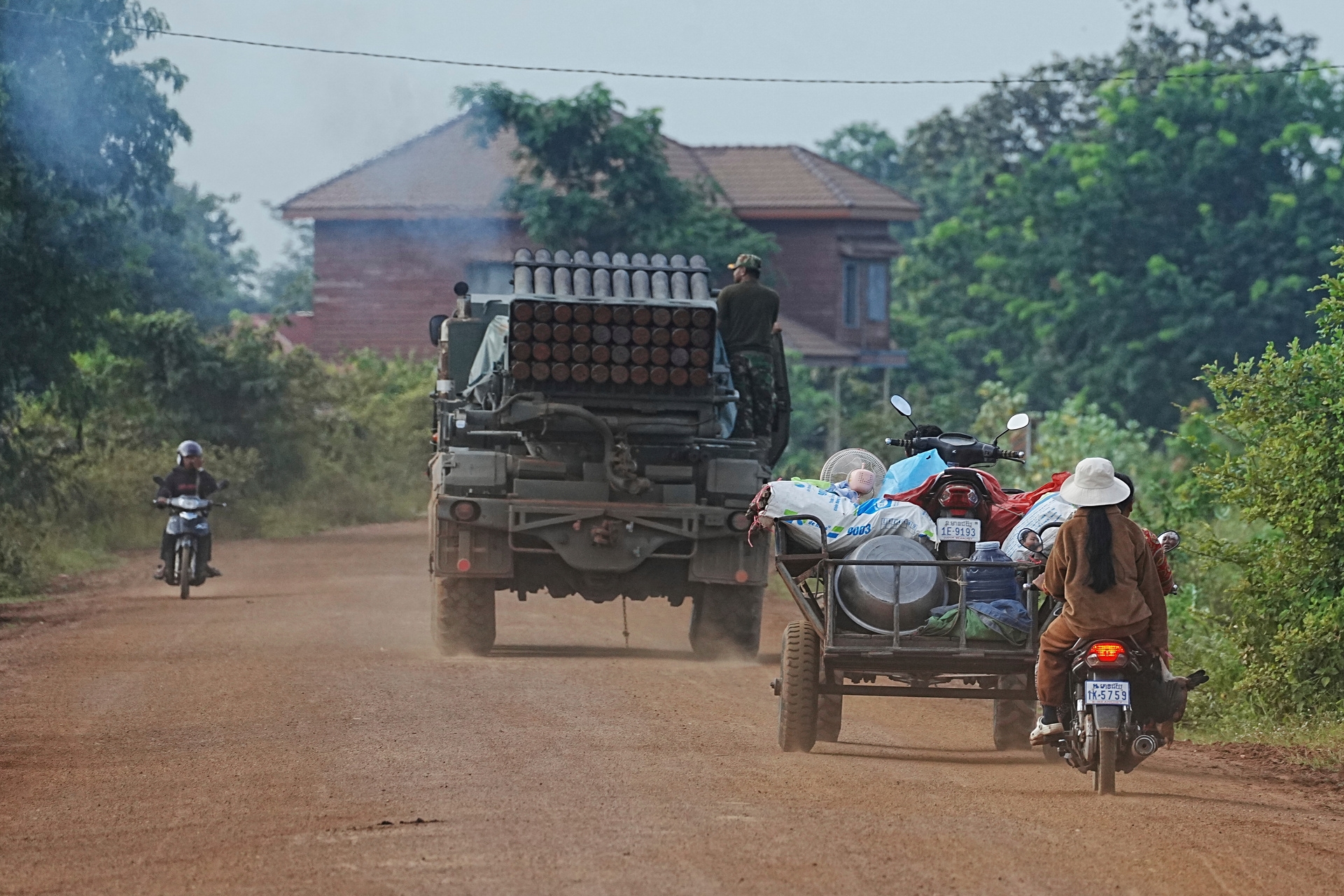 Thailand and Cambodia on the brink of war; clashes have left 15 dead and 140,000 displaced.