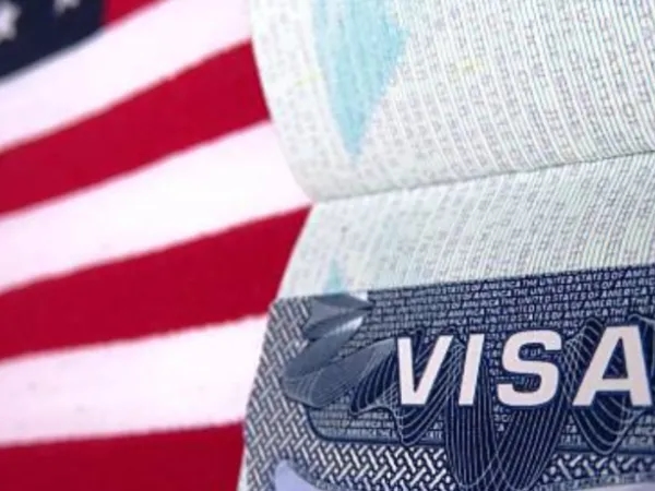 Should immigrants always carry their passport with them in the United States?